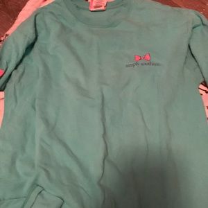 It’s a simple southern shirt, a bunch of different colors, and is a medium.